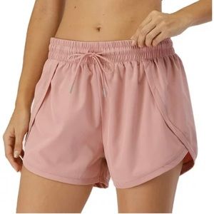 Lululemon light pale pink running shorts with built in spandex